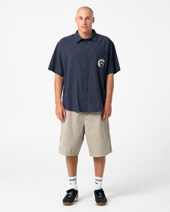 man-wearing-request-line-herringbone-short-in-abbey-stone