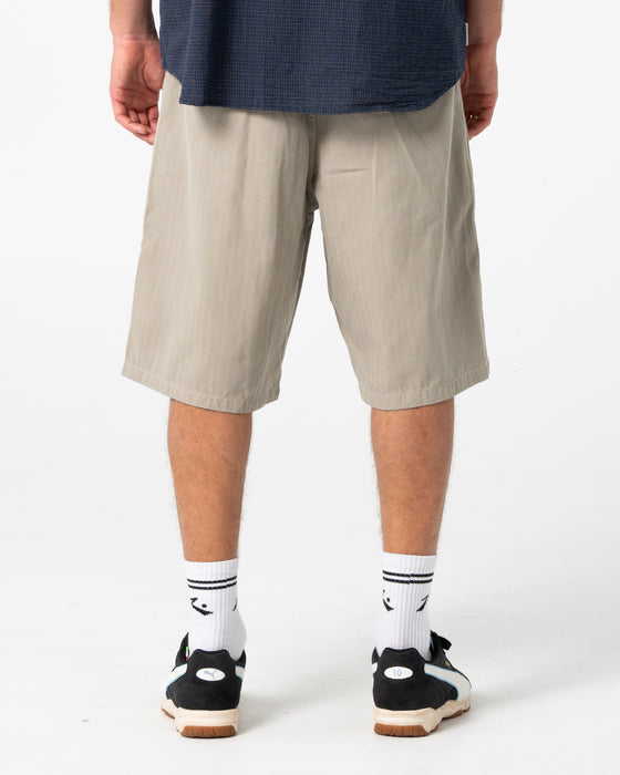 man-wearing-request-line-herringbone-short-in-abbey-stone