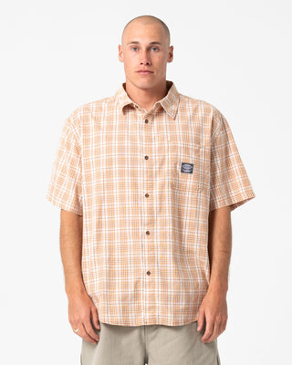 Man wearing Worldwide Curved Hem Short Sleeve Shirt in Tobacco