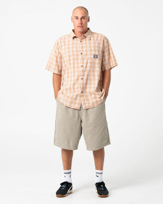 Man wearing Worldwide Curved Hem Short Sleeve Shirt in Tobacco