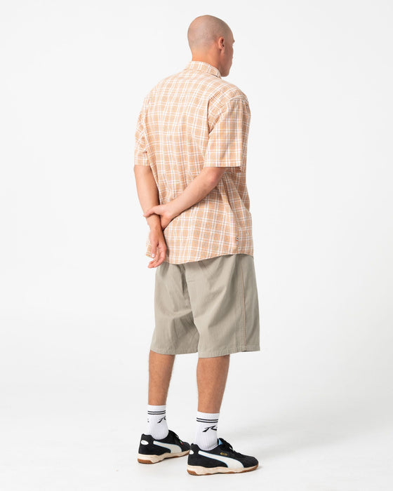 man-wearing-worldwide-curved-hem-short-sleeve-shirt-in-tobacco