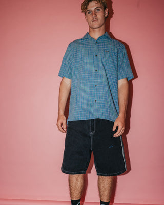 Man wearing Datsun Drop Short Sleeve Shirt in China Blue