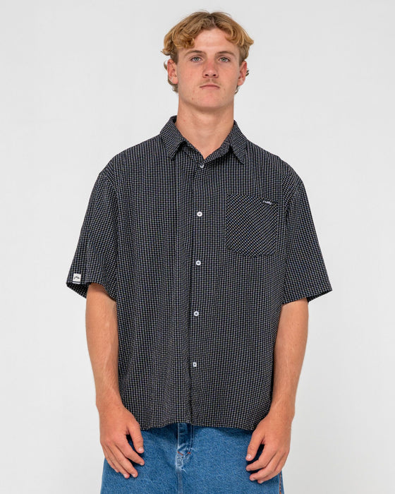 man-wearing-acemo-check-short-sleeve-shirt-in-black