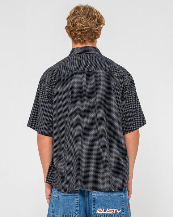 man-wearing-acemo-check-short-sleeve-shirt-in-black