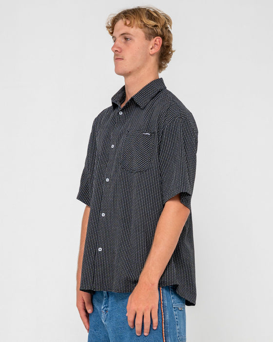man-wearing-acemo-check-short-sleeve-shirt-in-black