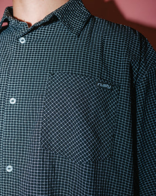 Man wearing Acemo Check Short Sleeve Shirt in Black