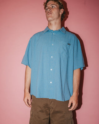 Man wearing Acemo Check Short Sleeve Shirt in China Blue