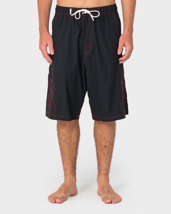 man-wearing-tombstones-hybrid-waist-boardshort-in-black-red