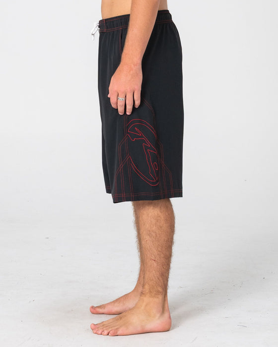 man-wearing-tombstones-hybrid-waist-boardshort-in-black-red