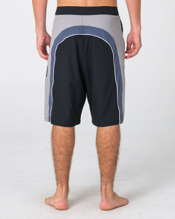 man-wearing-power-wing-fixed-waist-boardshort-in-black-grey