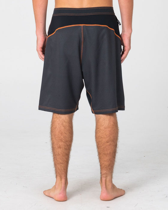 man-wearing-hydro-surge-fixed-waist-boardshort-in-black-2