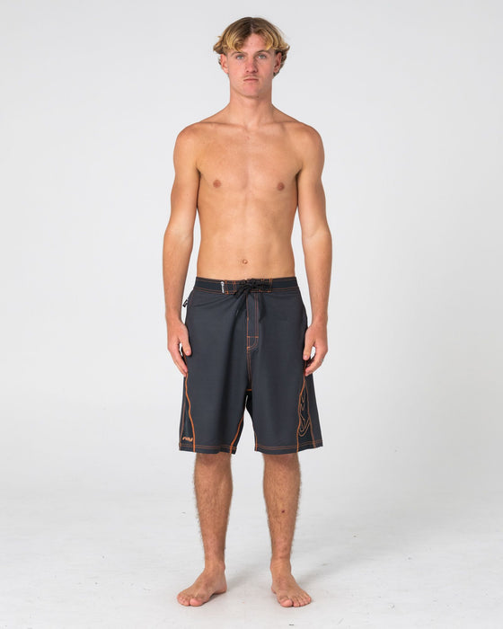 man-wearing-hydro-surge-fixed-waist-boardshort-in-black-2