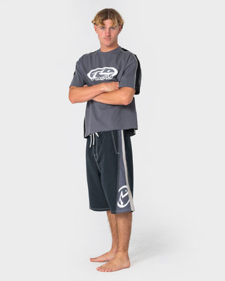 Man wearing Carnage Hybrid Waist Boardshort in Black 1