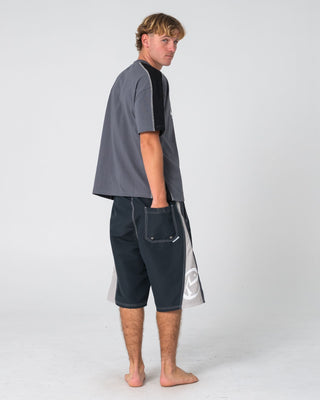 Man wearing Carnage Hybrid Waist Boardshort in Black 1