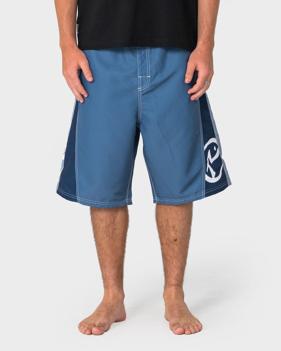 man-wearing-carnage-hybrid-waist-boardshort-in-china-blue