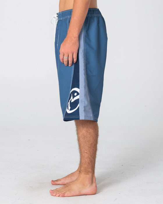 man-wearing-carnage-hybrid-waist-boardshort-in-china-blue