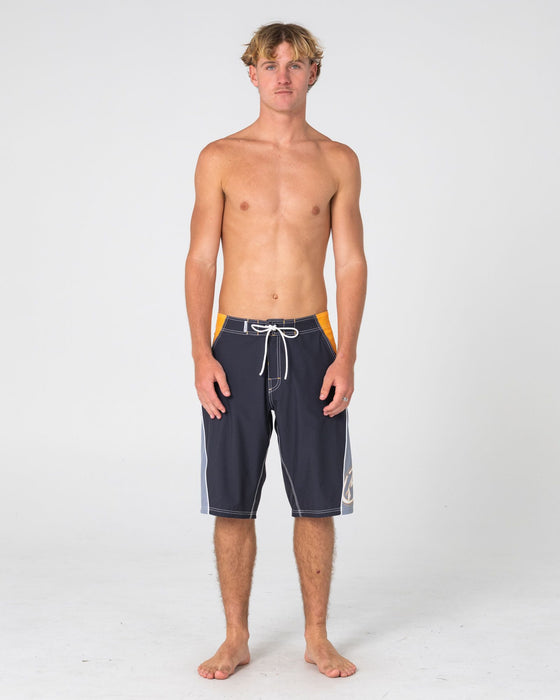 man-wearing-sandglass-fixed-waist-boardshort-in-coal