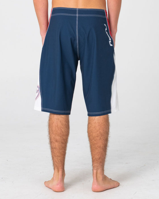 man-wearing-sandglass-fixed-waist-boardshort-in-navy-blue