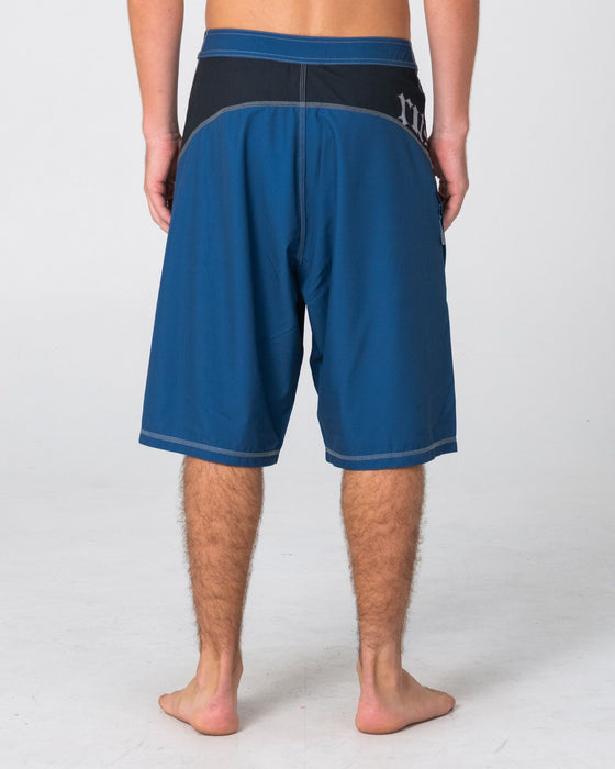 man-wearing-tribalay-fixed-waist-boardshort-in-atlantic-blue