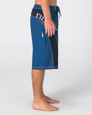 Man wearing Tribalay Fixed Waist Boardshort in Atlantic Blue