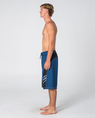 Man wearing Tribalay Fixed Waist Boardshort in Atlantic Blue