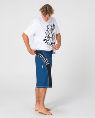 Man wearing Tribalay Fixed Waist Boardshort in Atlantic Blue