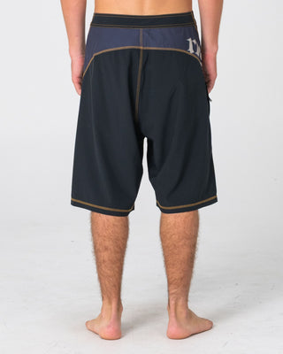 Man wearing Tribalay Fixed Waist Boardshort in Black