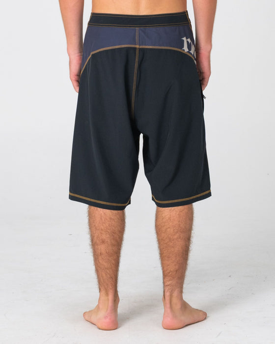 man-wearing-tribalay-fixed-waist-boardshort-in-black