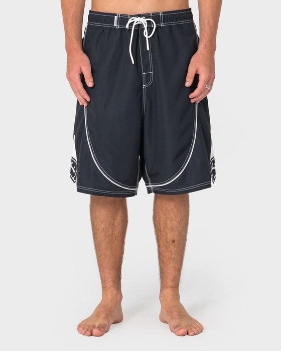 man-wearing-deathroll-hybrid-waist-boardshort-in-black