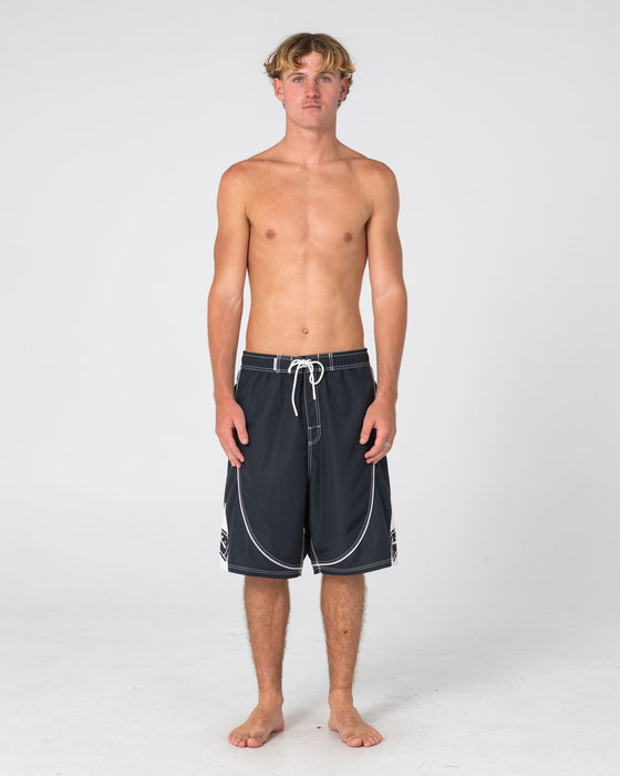 man-wearing-deathroll-hybrid-waist-boardshort-in-black
