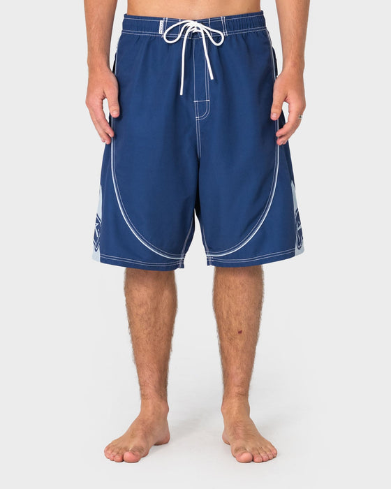 man-wearing-deathroll-hybrid-waist-boardshort-in-dark-blue