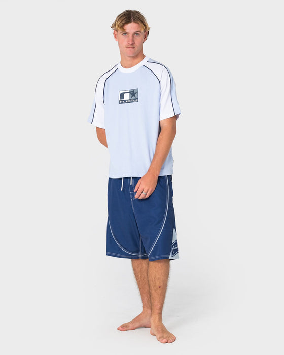 man-wearing-deathroll-hybrid-waist-boardshort-in-dark-blue