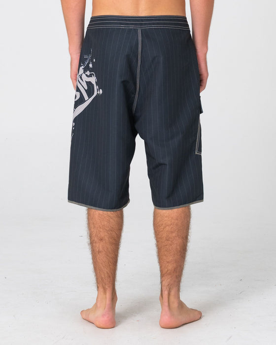 man-wearing-scribbla-fixed-waist-boardshort-in-black