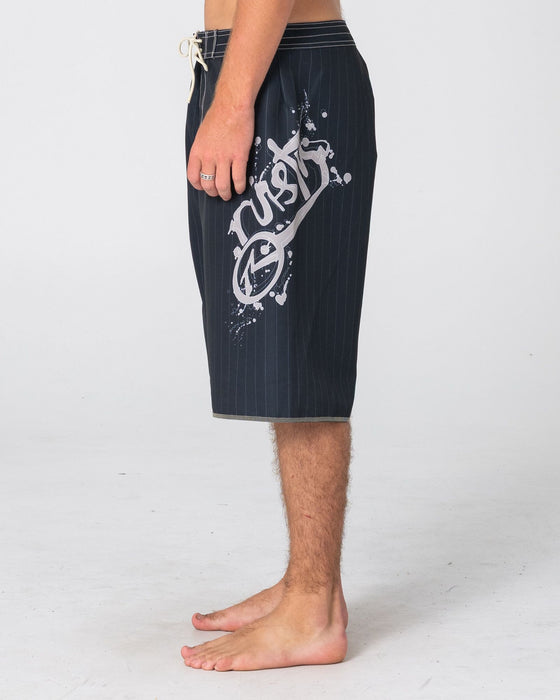 man-wearing-scribbla-fixed-waist-boardshort-in-black