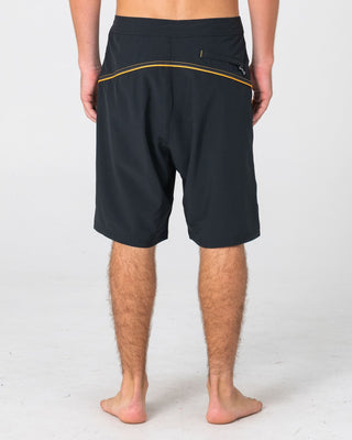 Man wearing Saber Tooth Fixed Waist Boardshort in Black