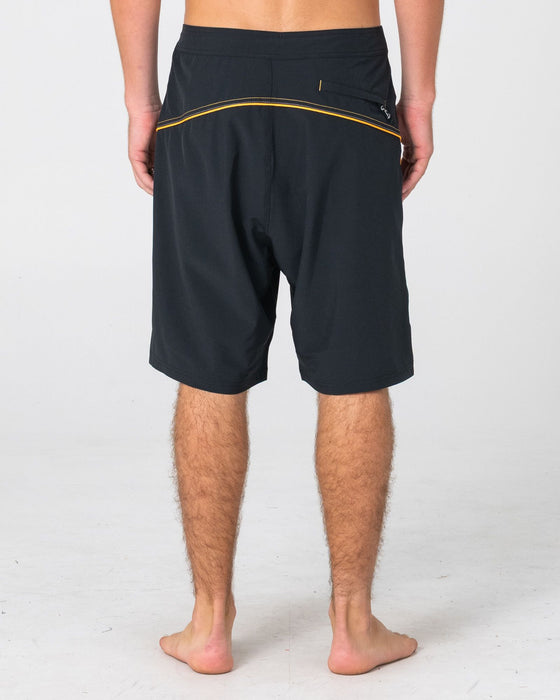 man-wearing-saber-tooth-fixed-waist-boardshort-in-black