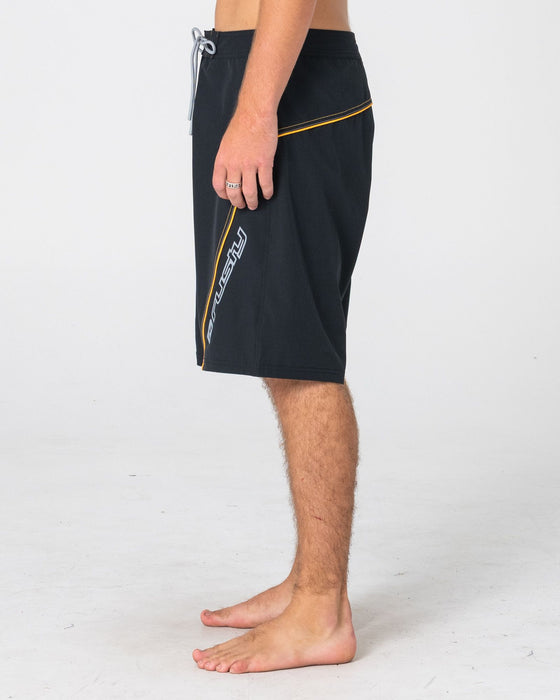man-wearing-saber-tooth-fixed-waist-boardshort-in-black