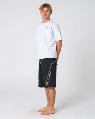 Man wearing Saber Tooth Fixed Waist Boardshort in Black