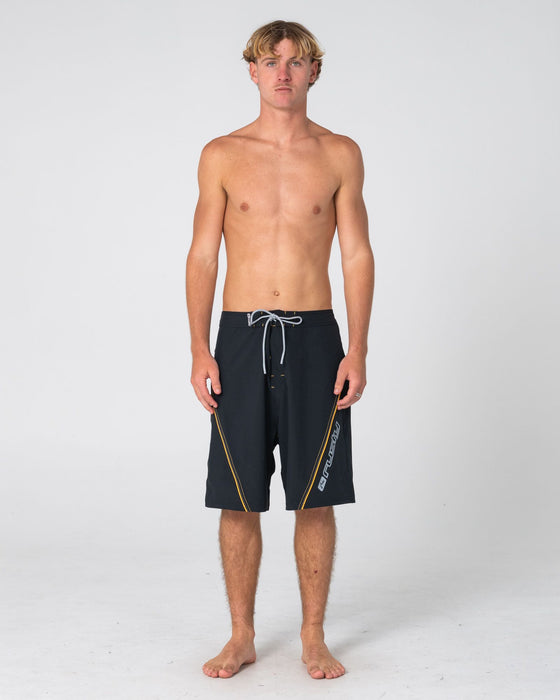 man-wearing-saber-tooth-fixed-waist-boardshort-in-black