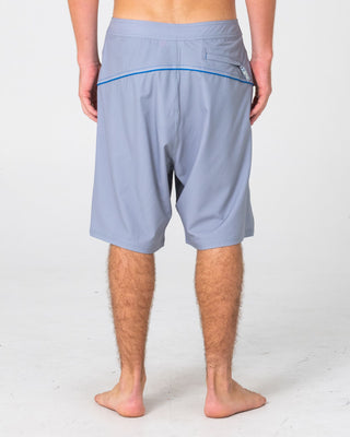 Man wearing Saber Tooth Fixed Waist Boardshort in Stone Grey