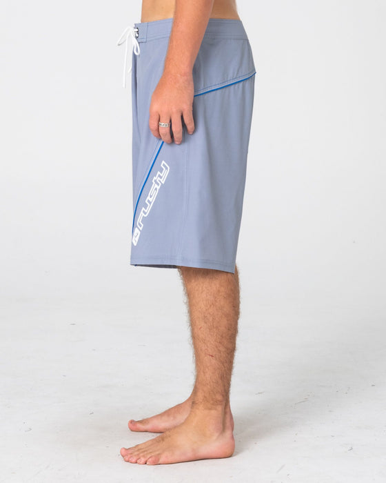 man-wearing-saber-tooth-fixed-waist-boardshort-in-stone-grey