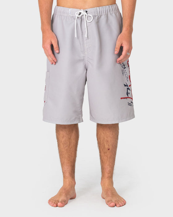 man-wearing-crisis-hybrid-waist-boardshort-in-abbey-stone