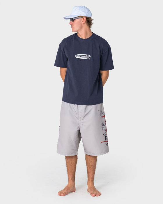 man-wearing-crisis-hybrid-waist-boardshort-in-abbey-stone