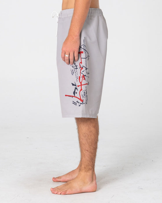 man-wearing-crisis-hybrid-waist-boardshort-in-abbey-stone