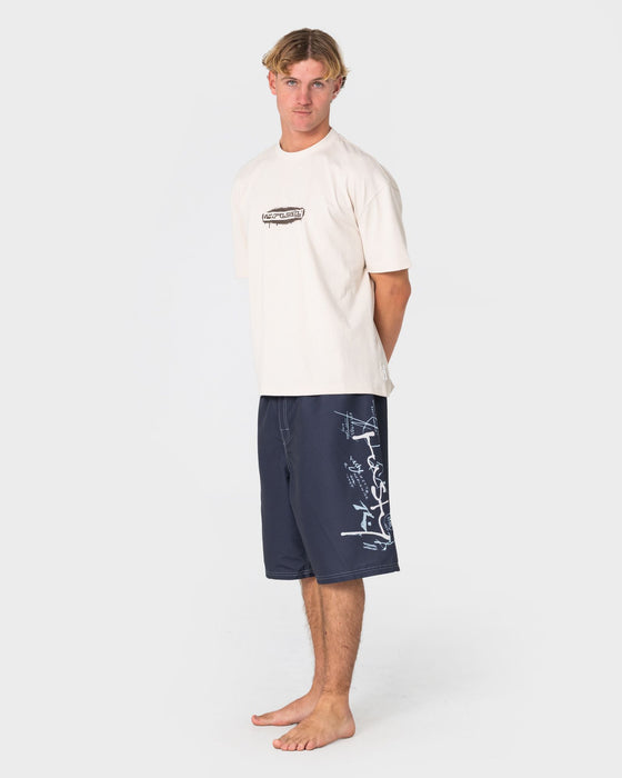 man-wearing-crisis-hybrid-waist-boardshort-in-coal