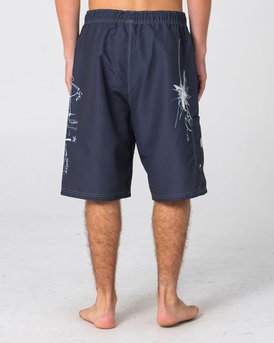 man-wearing-crisis-hybrid-waist-boardshort-in-coal