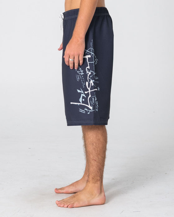 man-wearing-crisis-hybrid-waist-boardshort-in-coal