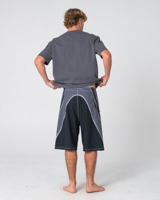 Man wearing Refract Fixed Waist Boardshort in Black