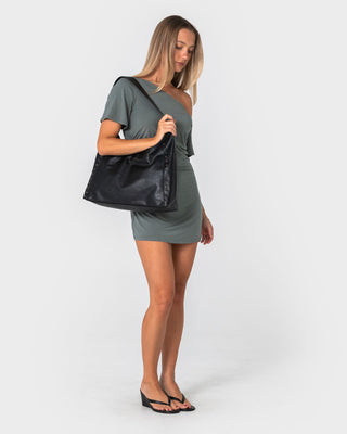 Woman wearing Sally Slouch Off Shoulder Dress in Khaki