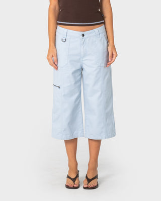 Woman wearing It Gyrl Low Rise Capri Cargo Pant in Pastel Blue